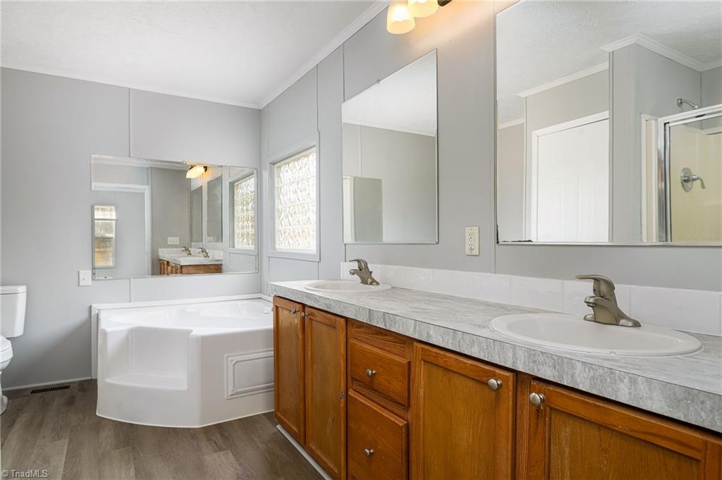 1591 Carson Road Pilot Mountain, NC 27041 - Photo 18 of 50 New countertops, faucets, lights, commode, flooring and paint!