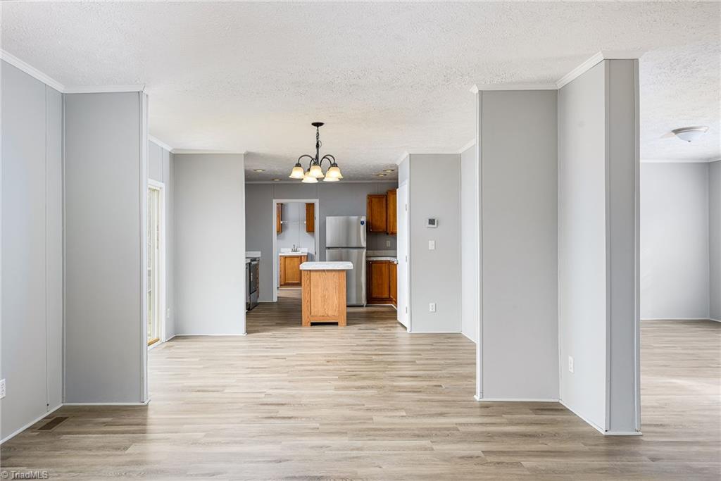 1591 Carson Road Pilot Mountain, NC 27041 - Photo 33 of 50 View from den to dining area to kitchen and laundry at the far end