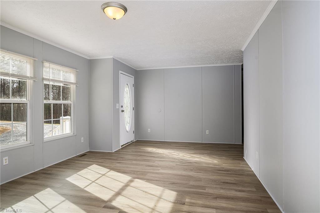 1591 Carson Road Pilot Mountain, NC 27041 - Photo 10 of 50 All new paint on walls and ceilings, with all new laminate flooring throughout every room-no carpet!!