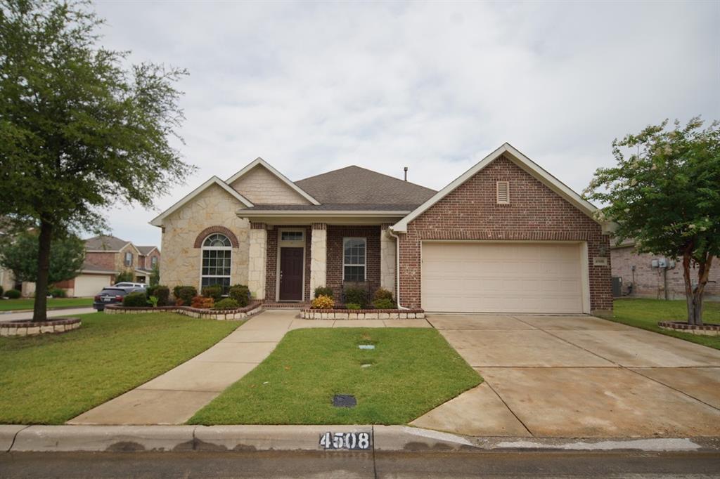 4508 Fox Rio Trail Arlington, TX 76017 - Photo 1 of 28 a front view of a house with a yard and garage