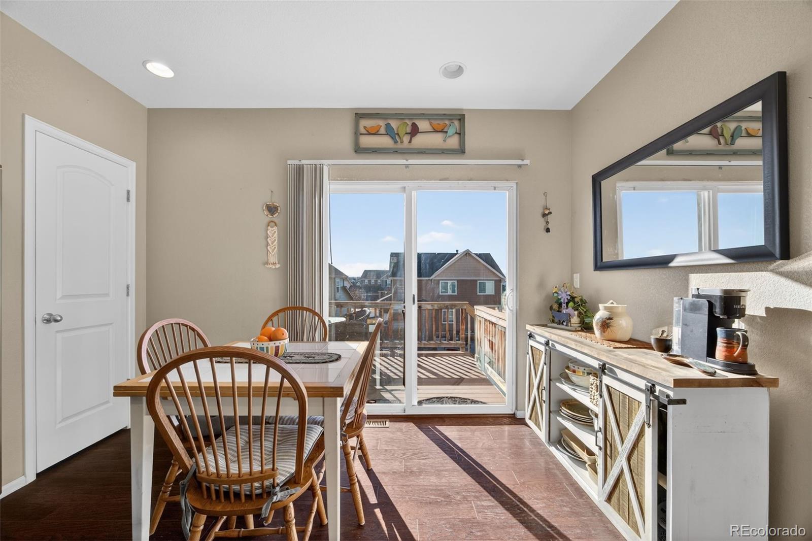 10247 Olathe Way Commerce City, CO 80022 - Photo 14 of 37 a view of a dining room with furniture and a window