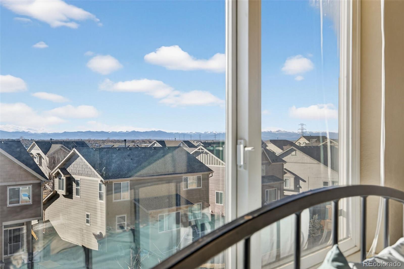 10247 Olathe Way Commerce City, CO 80022 - Photo 21 of 37 a view of a balcony with a swimming pool