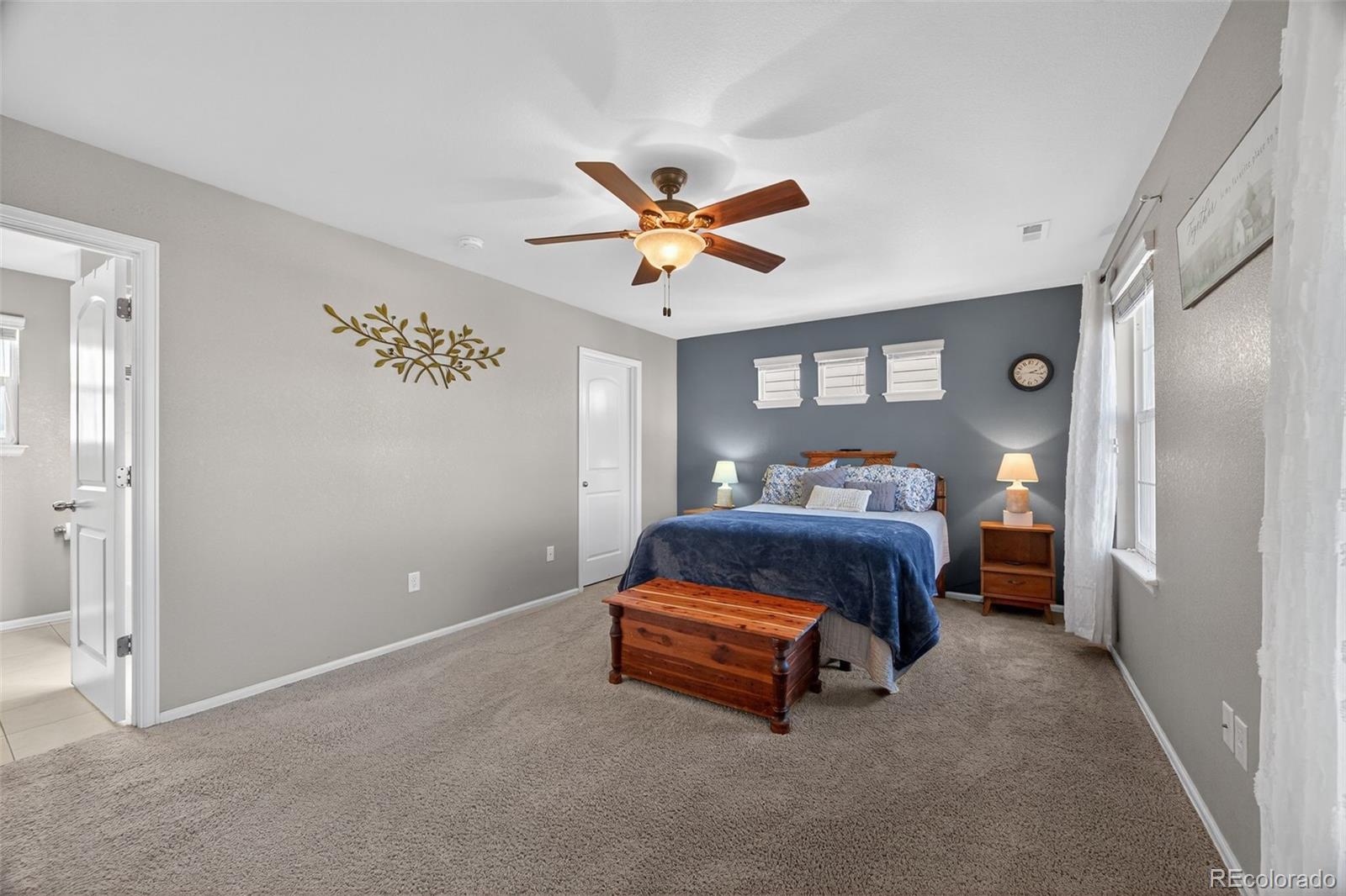 10247 Olathe Way Commerce City, CO 80022 - Photo 23 of 37 a bedroom with a bed and a ceiling fan