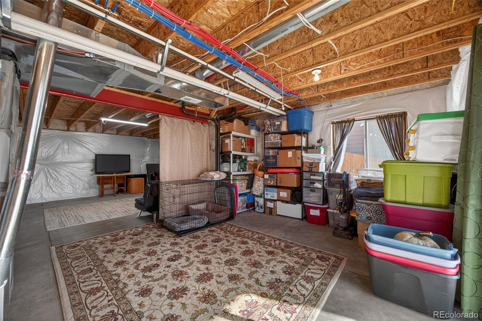10247 Olathe Way Commerce City, CO 80022 - Photo 29 of 37 a room with lots of storage and a table