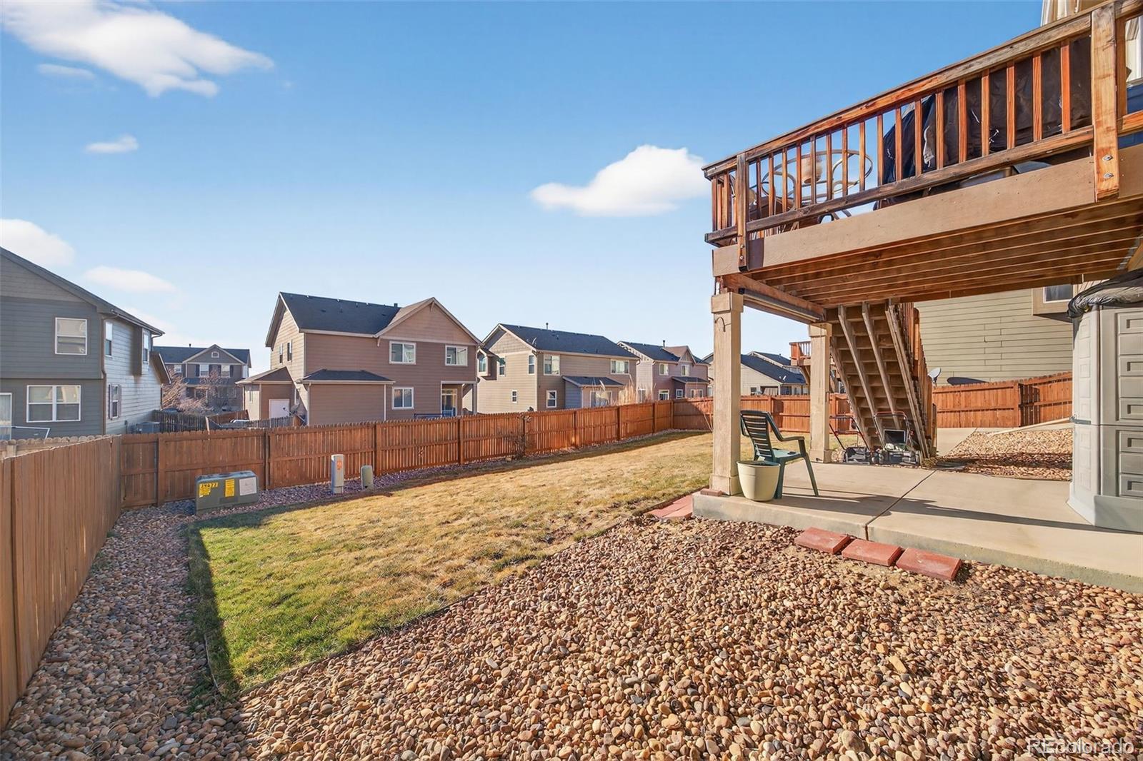 10247 Olathe Way Commerce City, CO 80022 - Photo 31 of 37 a view of a house with a balcony