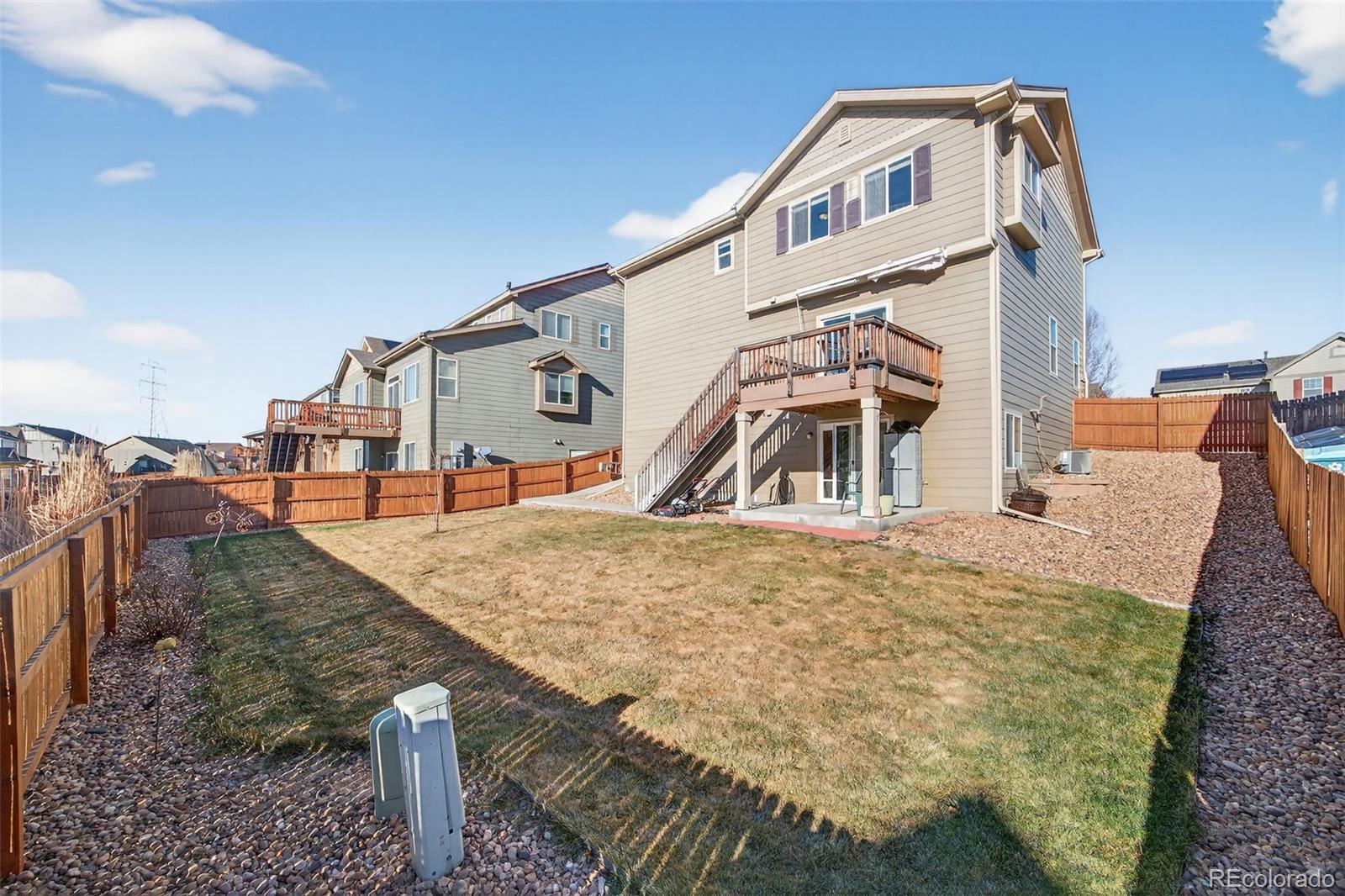 10247 Olathe Way Commerce City, CO 80022 - Photo 32 of 37 a view of a house with large trees