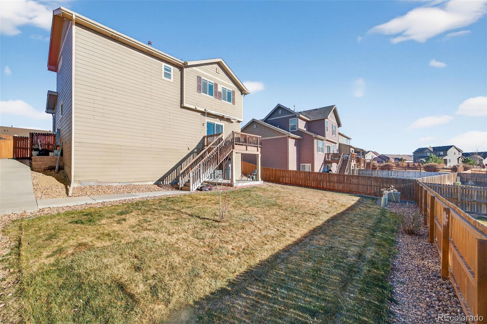 10247 Olathe Way Commerce City, CO 80022 - Photo 33 of 37 a house view with a outdoor space