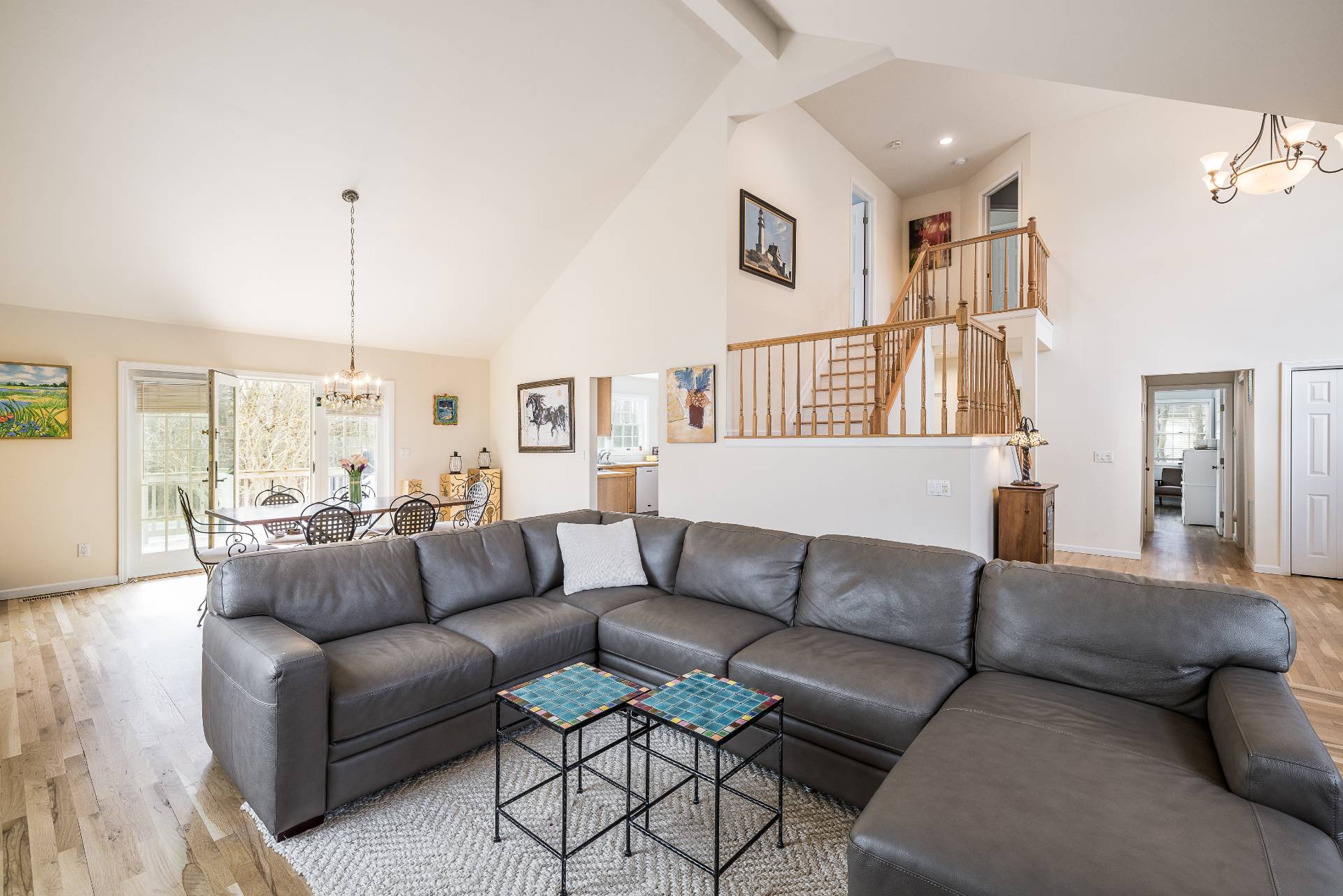 48 Tansey Lane Bridgehampton, NY 11932 - Photo 4 of 15 a living room with furniture and a chandelier