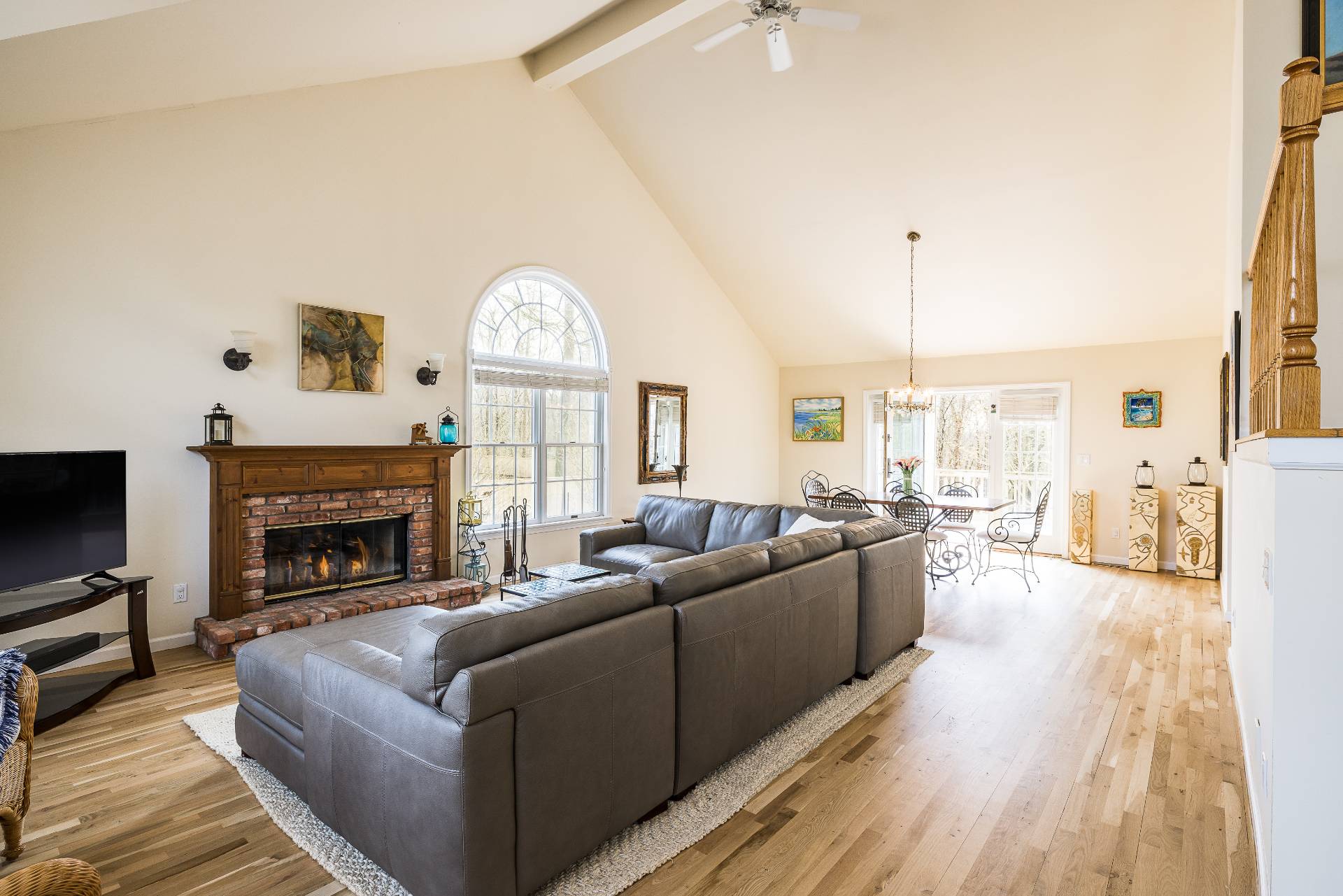 48 Tansey Lane Bridgehampton, NY 11932 - Photo 5 of 15 a living room with furniture large window and a fireplace