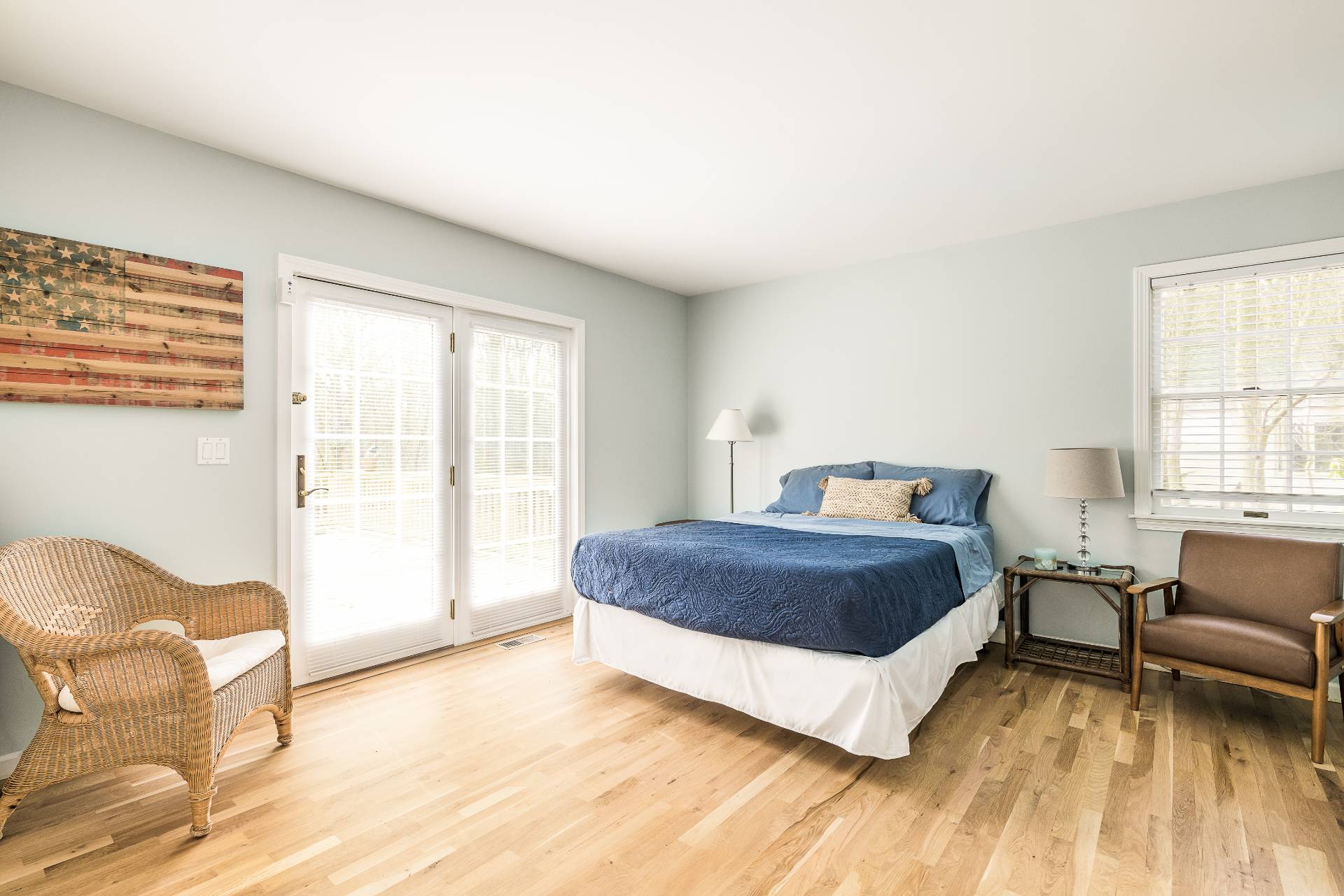 48 Tansey Lane Bridgehampton, NY 11932 - Photo 8 of 15 a spacious bedroom with a bed and a couch