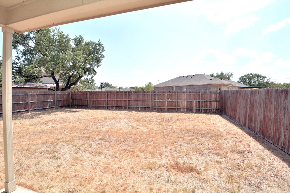 113 Thrasher Cove Leander, TX 78641 - Photo 17 of 19 Patio area to backyard