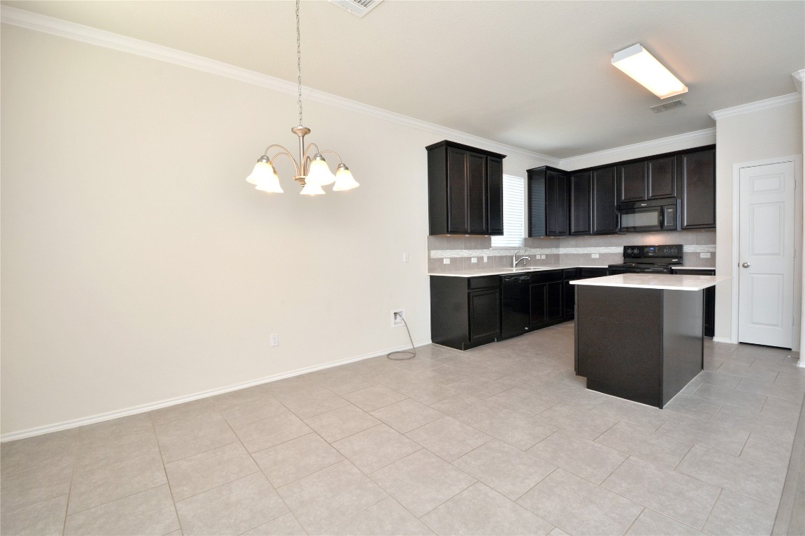 113 Thrasher Cove Leander, TX 78641 - Photo 5 of 19 Breakfast area to kitchen