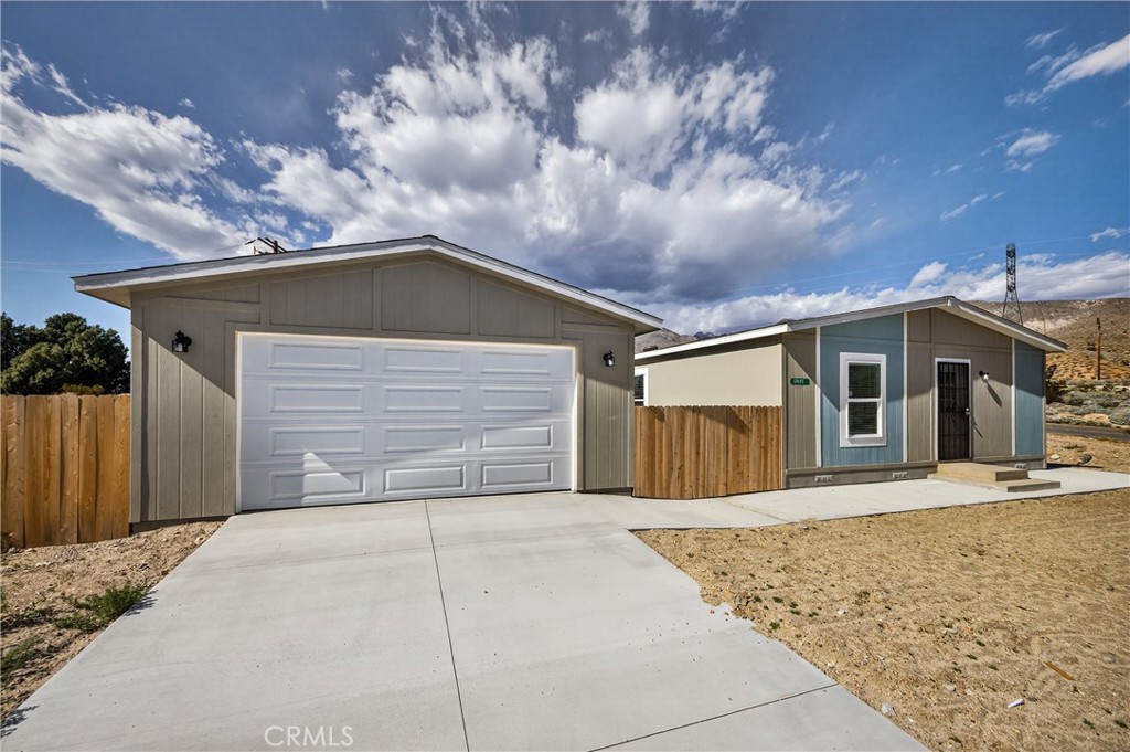 13425 Mesquite Road Whitewater, CA 92282 - Photo 1 of 26 a front view of a house with a yard and garage