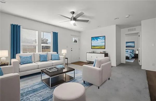 a living room with furniture and a large window