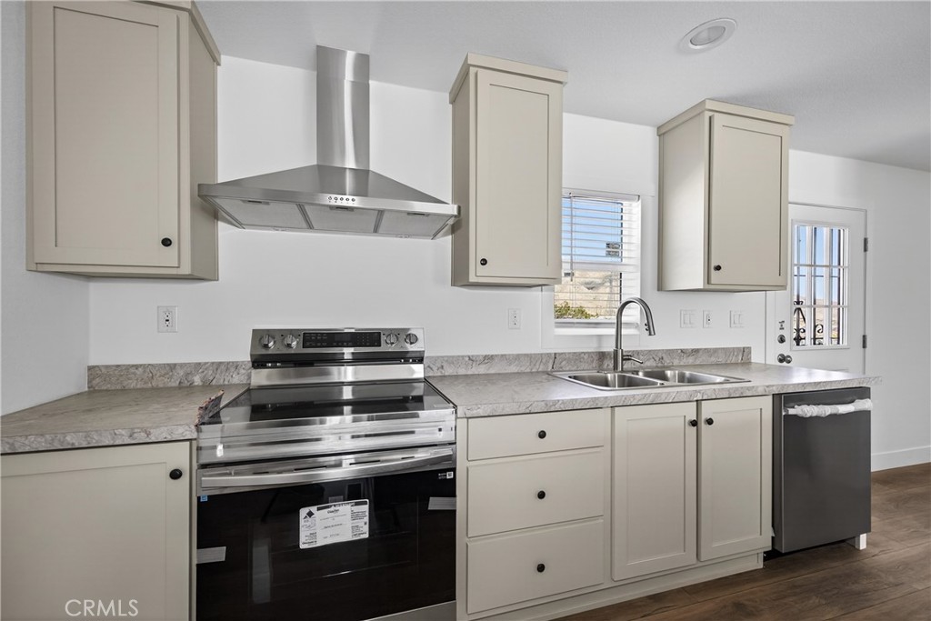 13425 Mesquite Road Whitewater, CA 92282 - Photo 15 of 26 a kitchen with granite countertop a sink stove and cabinets