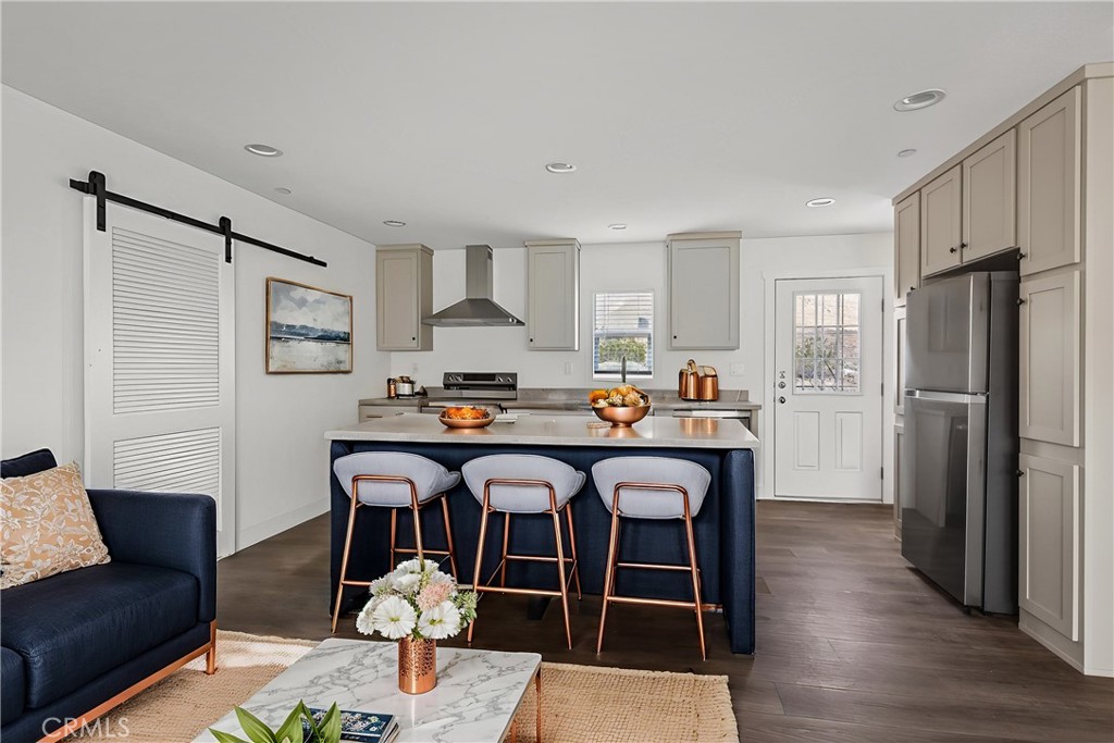 13425 Mesquite Road Whitewater, CA 92282 - Photo 17 of 26 a living room with stainless steel appliances granite countertop a couch and wooden floor