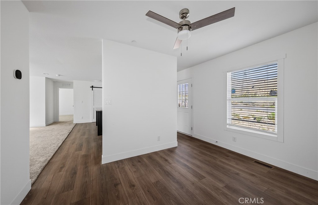 13425 Mesquite Road Whitewater, CA 92282 - Photo 19 of 26 a view of an empty room with wooden floor and a window