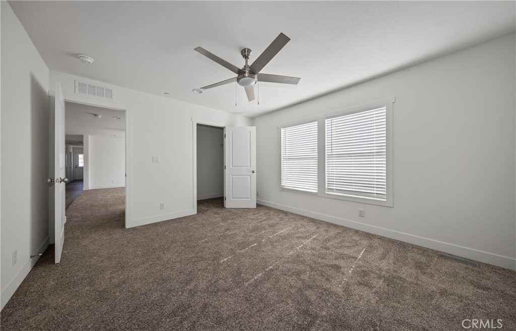 13425 Mesquite Road Whitewater, CA 92282 - Photo 20 of 26 an empty room with closet and windows