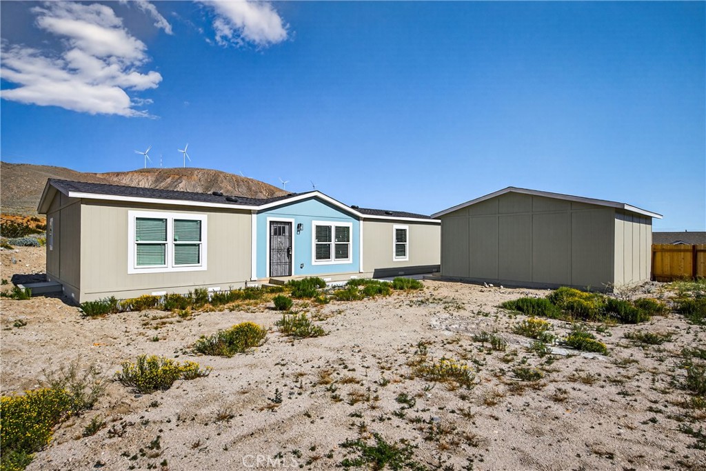 13425 Mesquite Road Whitewater, CA 92282 - Photo 2 of 26 a front view of a house with a yard