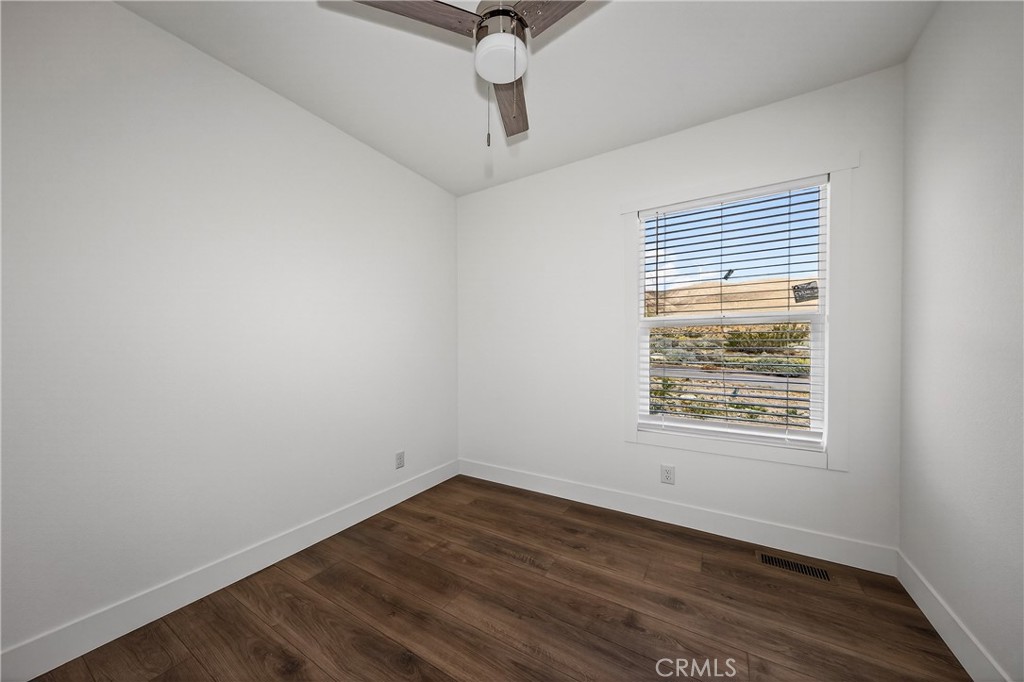 13425 Mesquite Road Whitewater, CA 92282 - Photo 26 of 26 a view of an empty room with wooden floor and a window