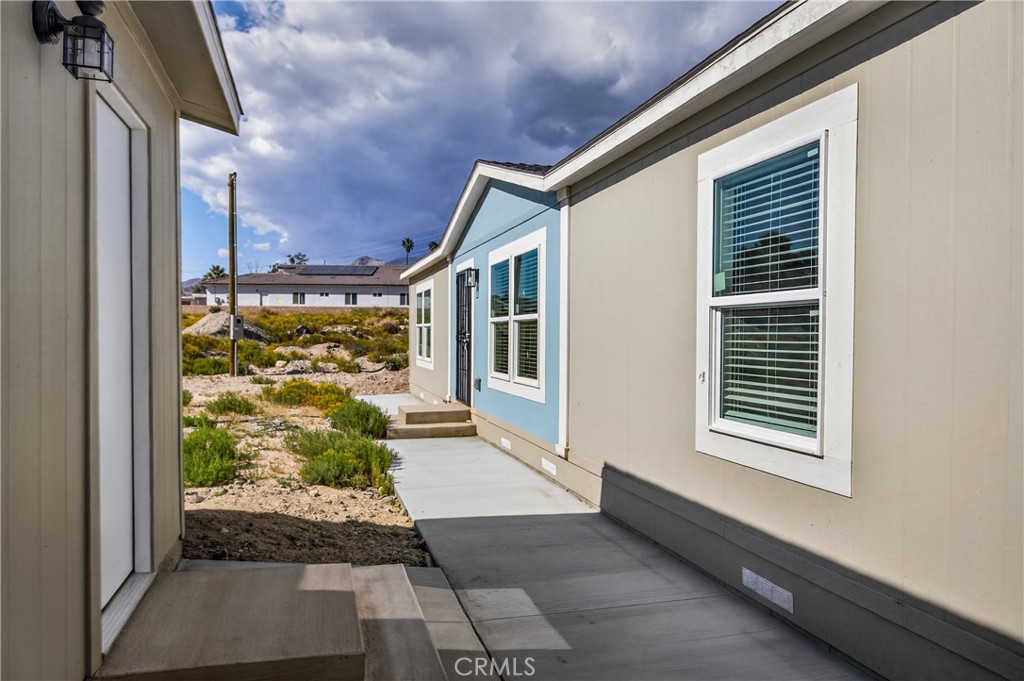 13425 Mesquite Road Whitewater, CA 92282 - Photo 3 of 26 a front view of a house with a yard