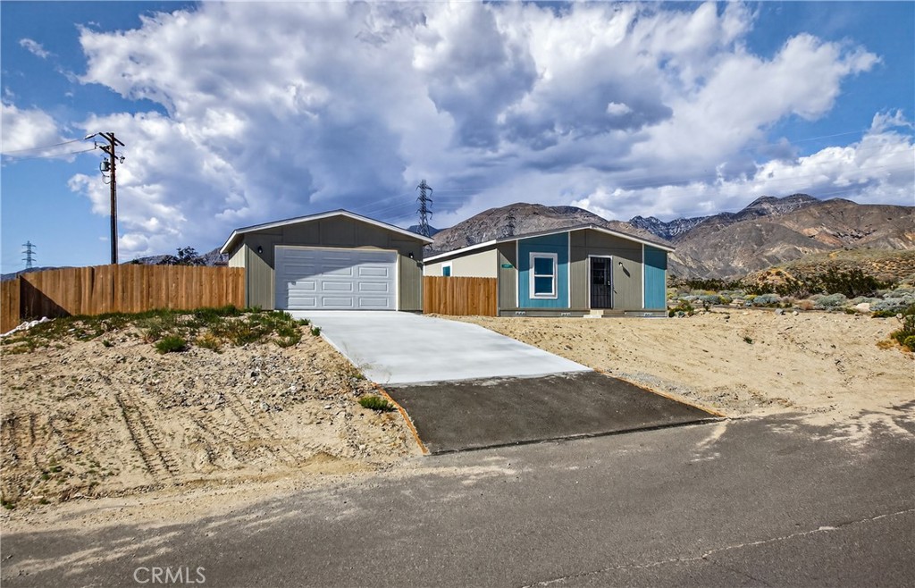 13425 Mesquite Road Whitewater, CA 92282 - Photo 4 of 26 a front view of a house with a yard