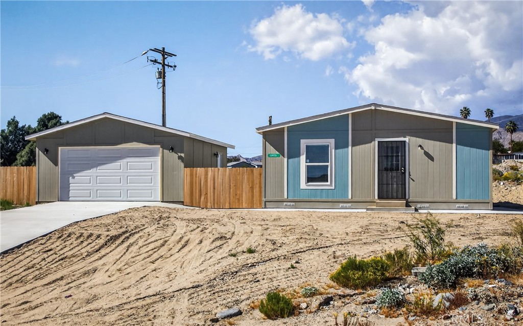 13425 Mesquite Road Whitewater, CA 92282 - Photo 6 of 26 a front view of a house with a yard