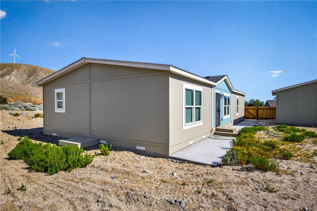 13425 Mesquite Road Whitewater, CA 92282 - Photo 7 of 26 a front view of a house with a yard