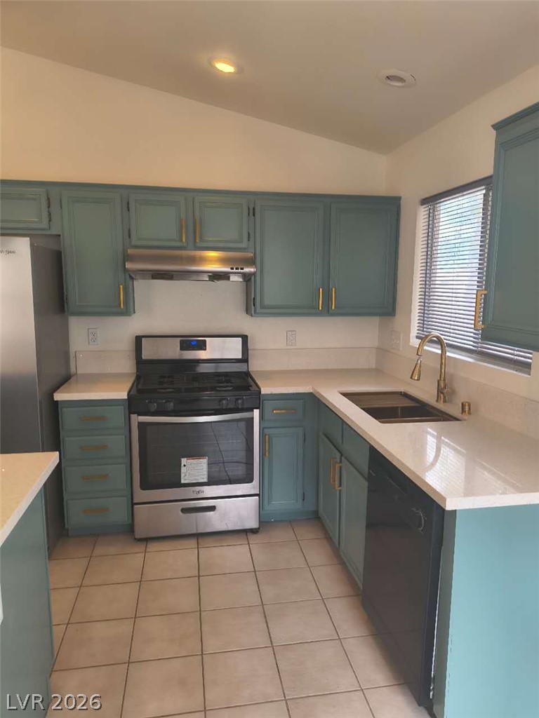 9725 Pima Point Avenue Las Vegas, NV 89147 - Photo 10 of 35 Culinary creations come alive in this kitchen featuring abundant counter space and a convenient double-basin sink.