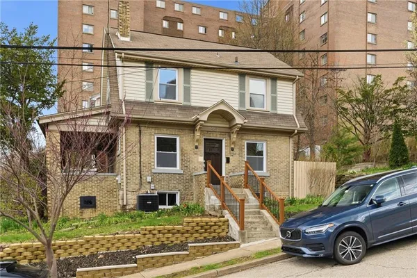 a car parked in front of a house