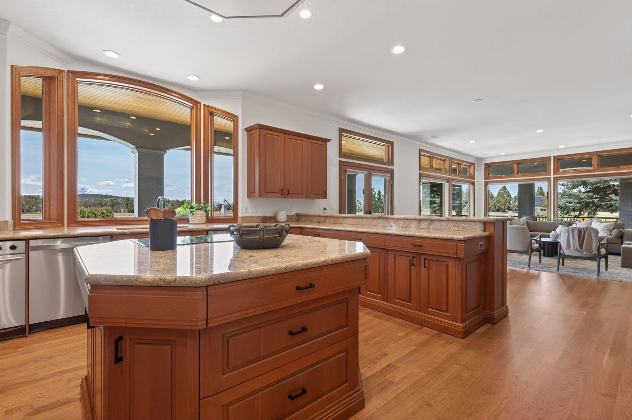 20180 Winston Loop Bend, OR 97703 - Photo 14 of 59 a kitchen with lots of counter top space and painting on the wall