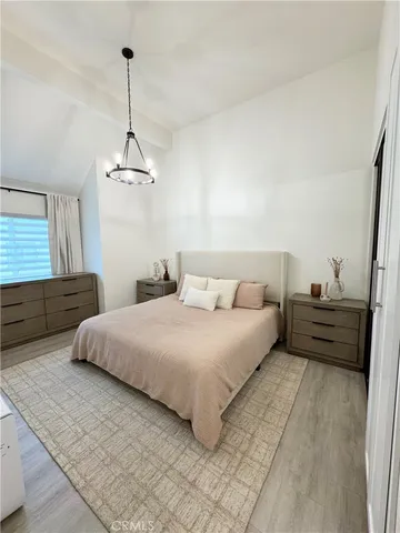 a bedroom with bed and window