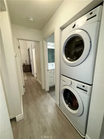 a view of a hallway with washer and dryer