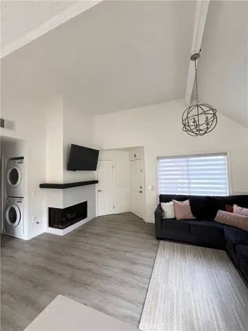 a view of room with furniture and wooden floor