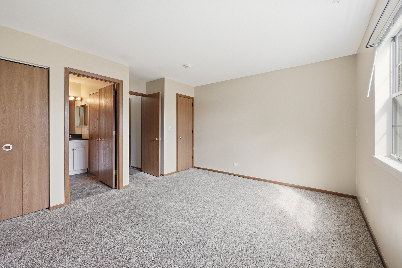 36 Gant Circle, Unit H Streamwood, IL 60107 - Photo 17 of 22 a view of an empty room with a window