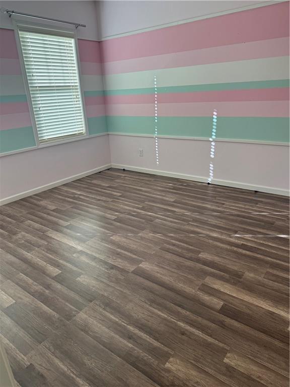 4185 Settlers Grove Road Cumming, GA 30028 - Photo 11 of 17 a view of a room with wooden floor and windows