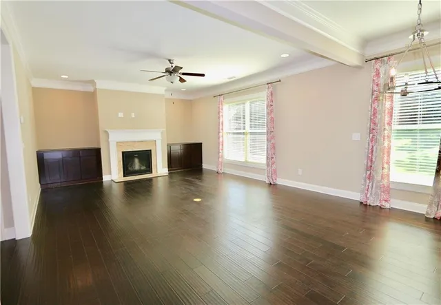 a view of livingroom with hardwood floor fireplace and window
