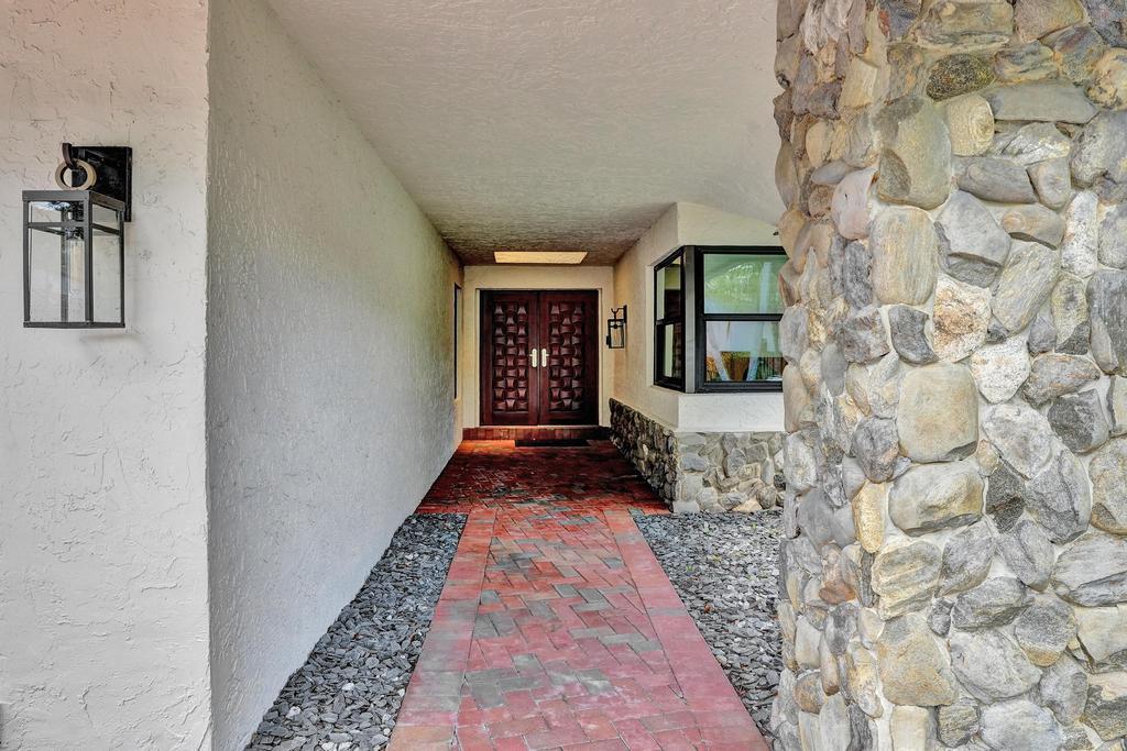 2845 Northwest 42nd Street Boca Raton, FL 33434 - Photo 6 of 75 Long covered patio