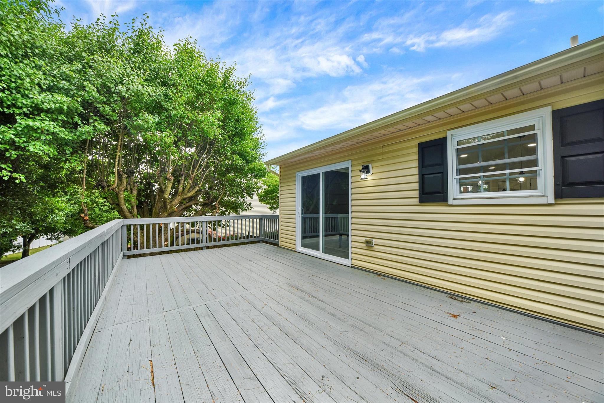 3808 Perryhurst Place Baltimore, MD 21236 - Photo 26 of 29 a view of a balcony with wooden floor and fence