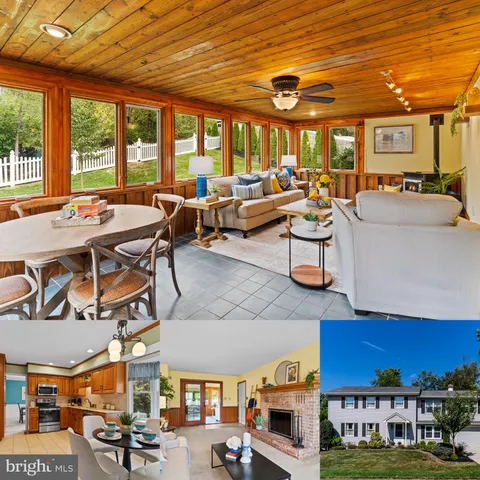 a living room with lots of furniture and a large window