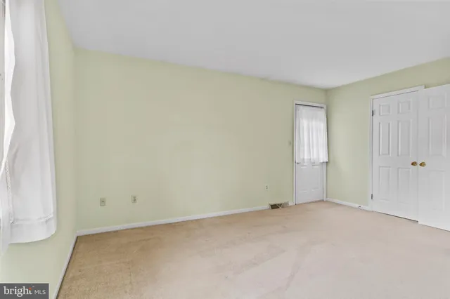 a view of an empty room and window