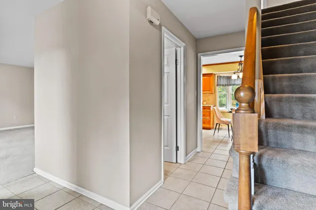 a view of walk in closet with empty room