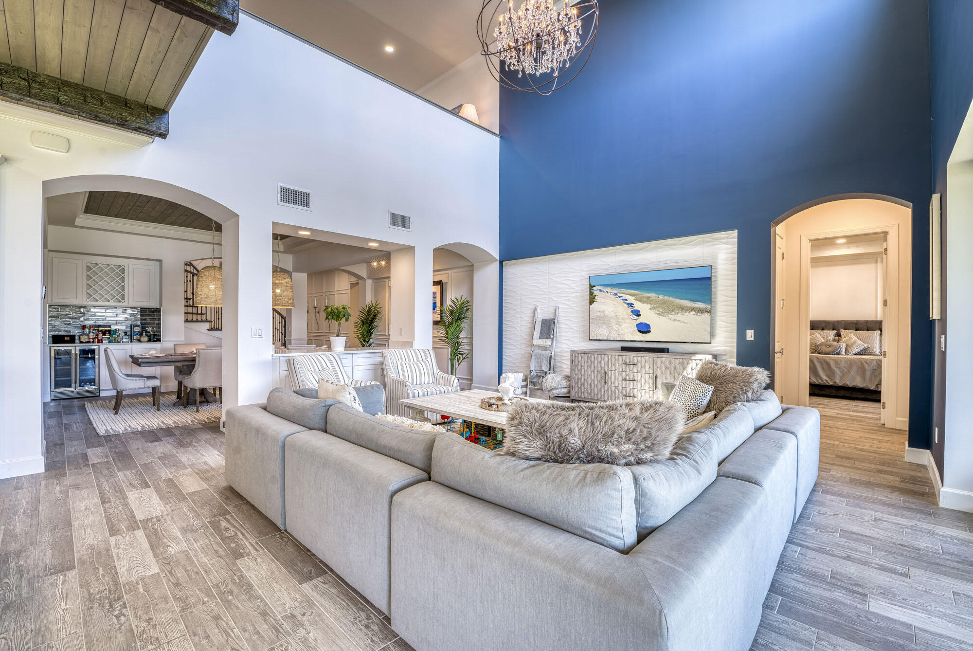 114 Cinder Dunes Point Jupiter, FL 33478 - Photo 16 of 62 a living room with furniture and a chandelier