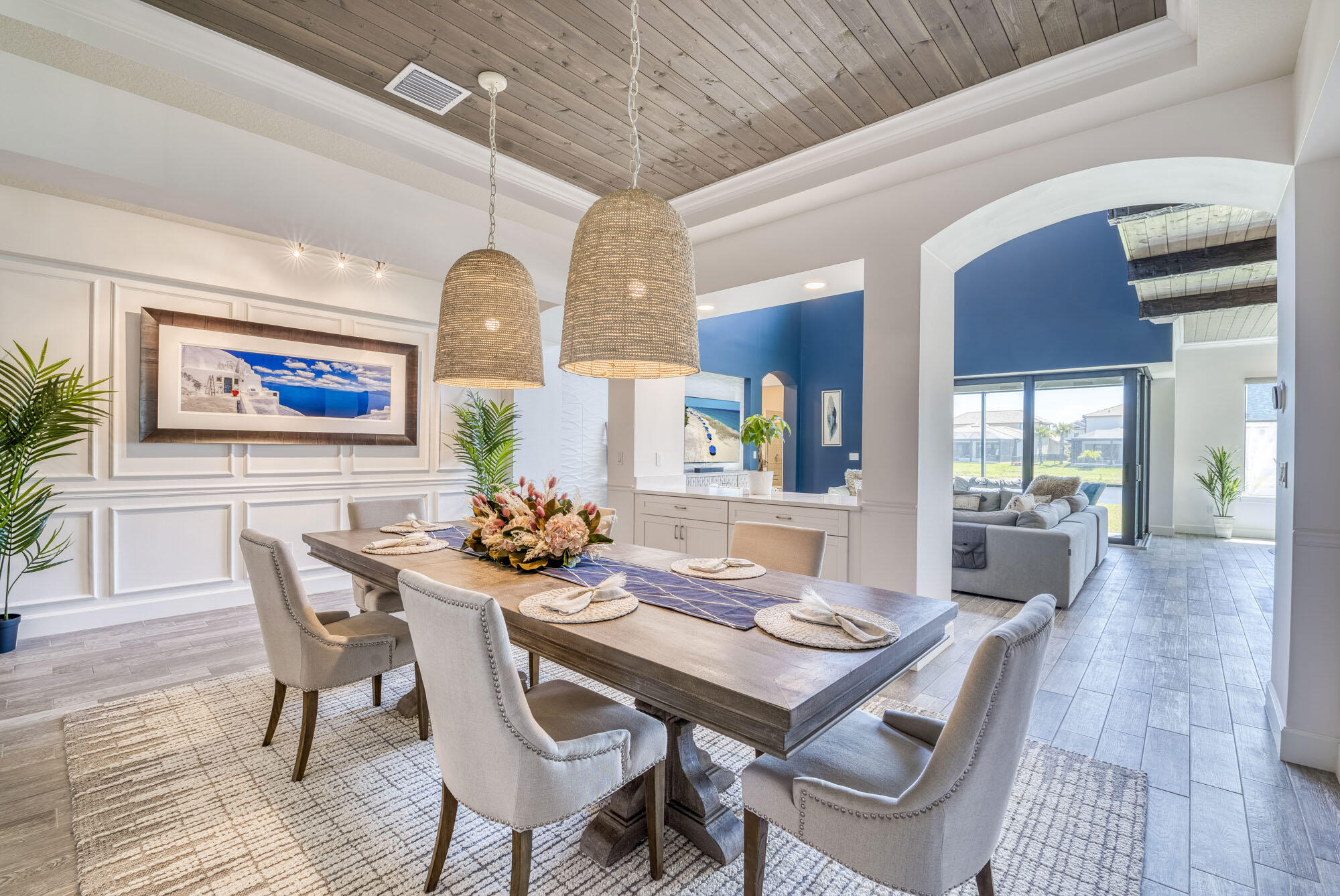 114 Cinder Dunes Point Jupiter, FL 33478 - Photo 20 of 62 a view of a dining room with furniture a chandelier and wooden floor