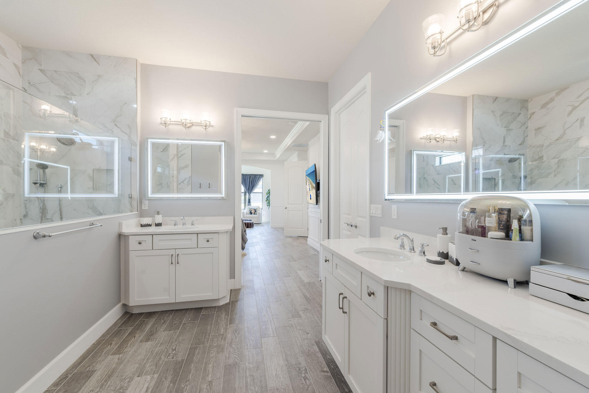 114 Cinder Dunes Point Jupiter, FL 33478 - Photo 28 of 62 a spacious bathroom with stainless steel appliances a double vanity sink and a mirror