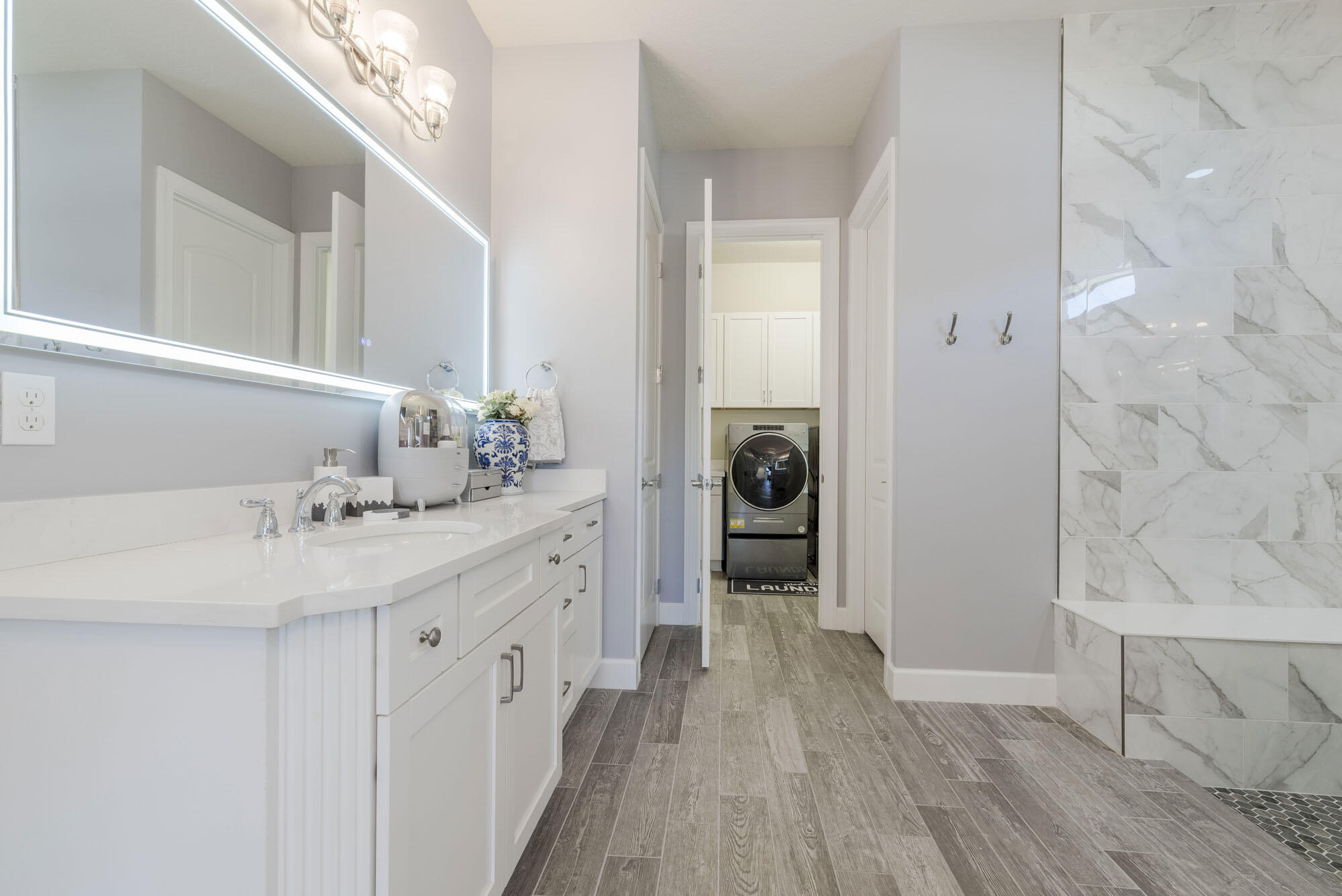 114 Cinder Dunes Point Jupiter, FL 33478 - Photo 30 of 62 a spacious bathroom with a sink and a mirror