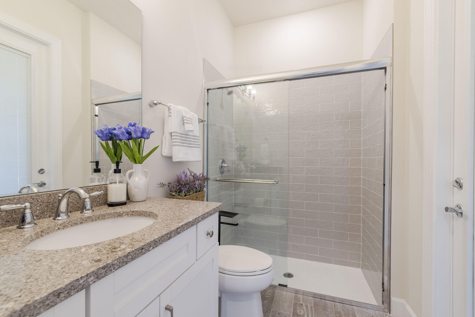 114 Cinder Dunes Point Jupiter, FL 33478 - Photo 34 of 62 a bathroom with a granite countertop sink toilet and shower