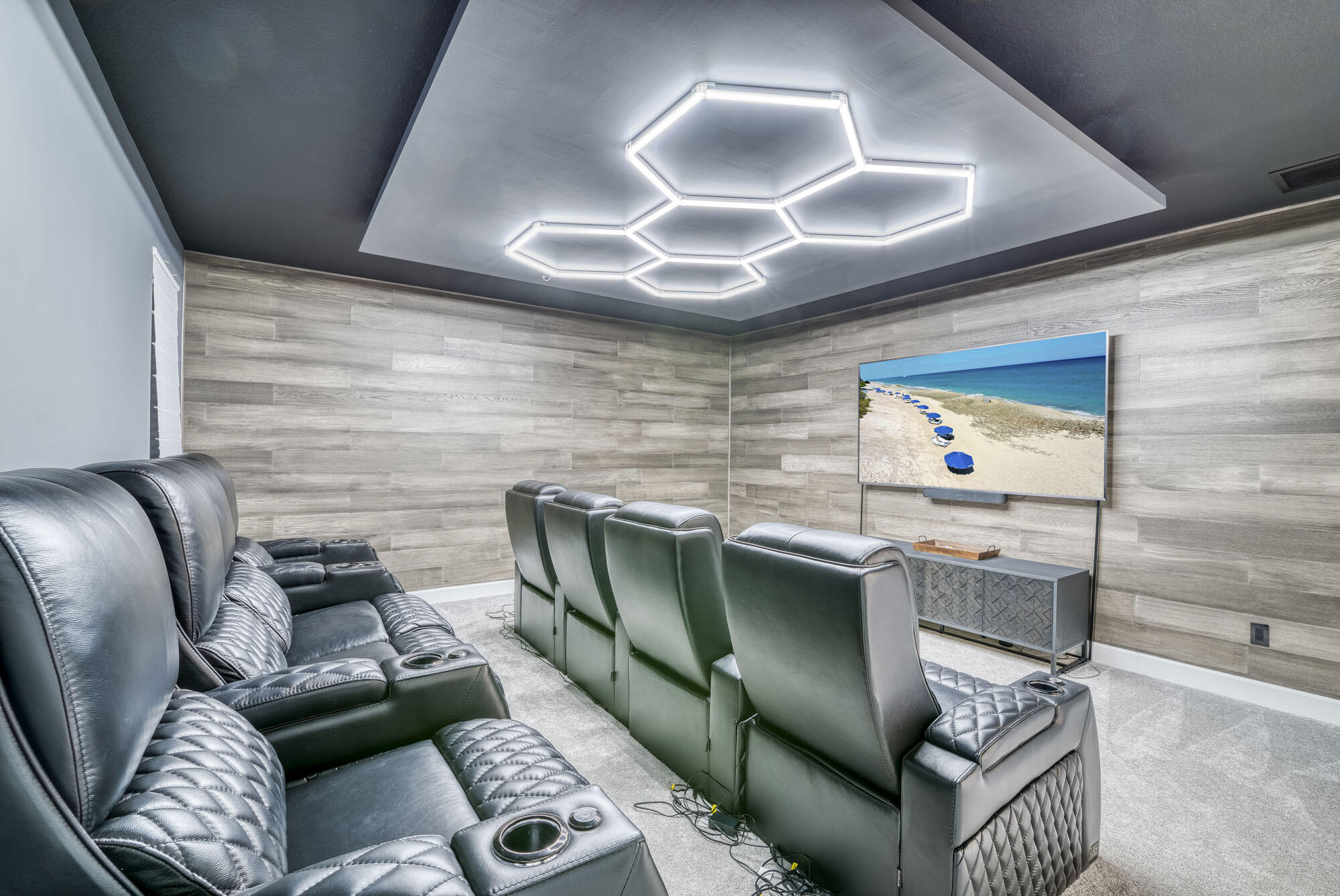 114 Cinder Dunes Point Jupiter, FL 33478 - Photo 38 of 62 a living room with furniture and a flat screen tv