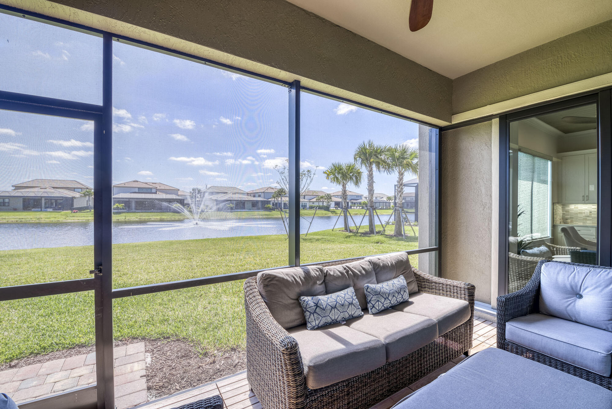 114 Cinder Dunes Point Jupiter, FL 33478 - Photo 53 of 62 a living room with furniture and a floor to ceiling window