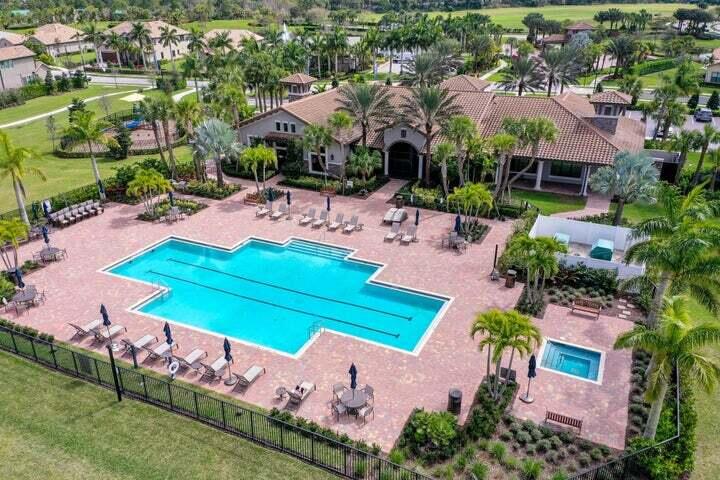 114 Cinder Dunes Point Jupiter, FL 33478 - Photo 57 of 62 an aerial view of a house with a garden